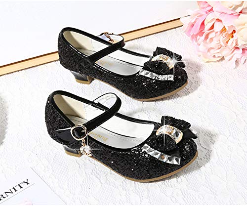 Adorable black glittery loafers with bow and jewelry designed by Cadidi Dinos