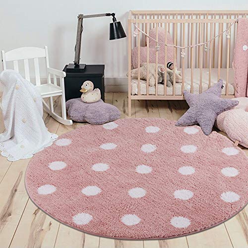 Round pink carpet with big white polka dots for a girl's bedroom 