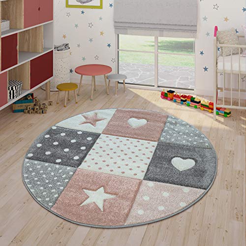 Round pink carpet with dots, hearts, stars pattern for a girl's bedroom 